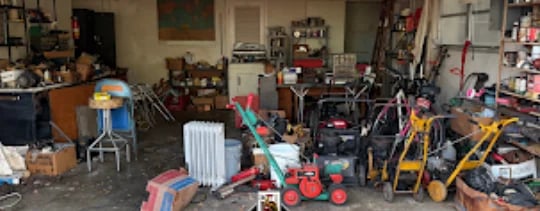 Junk removal Tampa Bay - Before garage cleanout in Tampa Bay, cluttered workshop with tools and equipment